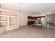 Spacious room featuring recessed shelves, and a view into the kitchen with island and cabinets at 16450 E Avenue Of The Fountain Ave # 11, Fountain Hills, AZ 85268