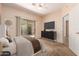 Serene main bedroom with a sliding glass door and dark furniture at 16450 E Avenue Of The Fountain Ave # 11, Fountain Hills, AZ 85268