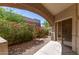 Covered patio with view of colorful bougainvillea bushes and desert garden at 16450 E Avenue Of The Fountain Ave # 11, Fountain Hills, AZ 85268