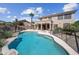 Stunning backyard with a sparkling pool, lush landscaping, and plenty of space to unwind and enjoy the outdoors at 16608 S 16Th Ave, Phoenix, AZ 85045