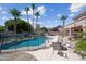 Enjoy the outdoors with a fenced pool, comfortable seating area, and lush landscaping, perfect for entertaining at 16608 S 16Th Ave, Phoenix, AZ 85045