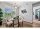 Bright dining area with hardwood floors, natural light, and an elegant chandelier at 16608 S 16Th Ave, Phoenix, AZ 85045