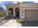 Charming home with a tile roof, stucco exterior, arched entryway, and two car garage at 16608 S 16Th Ave, Phoenix, AZ 85045