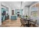 Eat-in kitchen with stainless appliances, breakfast table, and plenty of natural light from large windows at 16608 S 16Th Ave, Phoenix, AZ 85045