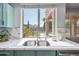 Kitchen sink with view to the backyard pool area and bright light shining through the window at 16608 S 16Th Ave, Phoenix, AZ 85045