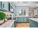 Stylish kitchen with blue cabinets, stainless appliances, and light marble countertops under bright light at 16608 S 16Th Ave, Phoenix, AZ 85045
