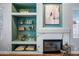Close-up of a living room fireplace and built-in shelving at 16608 S 16Th Ave, Phoenix, AZ 85045