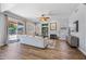 Bright living room featuring hardwood floors, neutral walls, and a gas fireplace at 16608 S 16Th Ave, Phoenix, AZ 85045