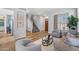 Bright living room with hardwood floors, neutral walls, and large window with a view of the neighborhood at 16608 S 16Th Ave, Phoenix, AZ 85045