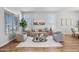 Cozy living room with hardwood floors, neutral walls, and large windows that let in plenty of natural light at 16608 S 16Th Ave, Phoenix, AZ 85045