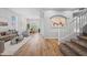 Open-concept living area with hardwood flooring, neutral walls, and a staircase to the second floor at 16608 S 16Th Ave, Phoenix, AZ 85045