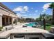 Entertain outdoors in the well-equipped kitchen and bar, with a lovely view of the pool and manicured backyard at 16608 S 16Th Ave, Phoenix, AZ 85045