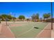 This is the community basketball court with desert landscaping and lighting for evening games at 1702 W Amberwood Dr, Phoenix, AZ 85045