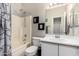 Bathroom featuring a bathtub-shower, toilet, vanity, and neutral wall colors at 1702 W Amberwood Dr, Phoenix, AZ 85045