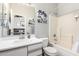 Bathroom with a single sink vanity, toilet, and a shower-tub combination at 1702 W Amberwood Dr, Phoenix, AZ 85045