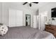 Bedroom featuring a queen size bed, closet, and entryway to the ensuite bathroom at 1702 W Amberwood Dr, Phoenix, AZ 85045