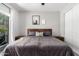 Bedroom with a queen size bed, wooden nightstands, and neutral-toned decor at 1702 W Amberwood Dr, Phoenix, AZ 85045