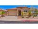 Charming single-story home with a desert-landscaped front yard and a red tile roof at 1702 W Amberwood Dr, Phoenix, AZ 85045