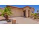 Attractive home featuring a well-maintained front yard with desert landscaping elements at 1702 W Amberwood Dr, Phoenix, AZ 85045