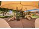 Community playground with sunshade, slides, desert landscaping and access to neighborhood amenities at 1702 W Amberwood Dr, Phoenix, AZ 85045