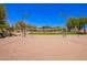 Picture of the community sand volleyball court surrounded by desert landscaping and ample lighting at 1702 W Amberwood Dr, Phoenix, AZ 85045
