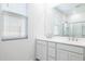 Bathroom features double sink vanity, shower with glass door, and bright lighting at 17743 W Onyx Ave, Waddell, AZ 85355