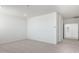 Spacious bedroom with neutral carpet and crisp white walls, ready for personalization at 17743 W Onyx Ave, Waddell, AZ 85355