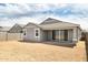 Backyard with patio and block fence at 17773 W Onyx Ave, Waddell, AZ 85355