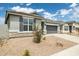 Charming single-story home with gray stucco, stone accents, a two-car garage, and low maintenance landscaping at 17773 W Onyx Ave, Waddell, AZ 85355