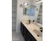 Bathroom featuring a double sink vanity with sleek black fixtures and neutral countertops at 1800 W Elliot Rd # 107, Chandler, AZ 85224