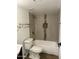 Updated bathroom featuring tiled shower/tub combo and modern fixtures at 1800 W Elliot Rd # 107, Chandler, AZ 85224