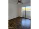 Bright bedroom featuring wood flooring and sliding glass doors for natural light at 1800 W Elliot Rd # 107, Chandler, AZ 85224