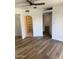 Bright bedroom with wood floors, closet with mirrored door, and easy access to other rooms at 1800 W Elliot Rd # 107, Chandler, AZ 85224