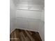 Walk-in closet with wood flooring and white wire shelving at 1800 W Elliot Rd # 107, Chandler, AZ 85224
