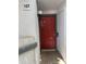 Exterior view of unit entry featuring a red front door with the unit number displayed at 1800 W Elliot Rd # 107, Chandler, AZ 85224