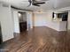 Large living area featuring sleek flooring, wet bar, neutral wall color, and modern lighting at 1800 W Elliot Rd # 107, Chandler, AZ 85224