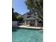 Community pool with lounge chairs and shaded gazebo, perfect for relaxation and social gatherings at 1800 W Elliot Rd # 107, Chandler, AZ 85224