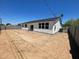Large backyard featuring block fence and an open canvas for landscaping and outdoor activities at 1835 E Burgess Ln, Phoenix, AZ 85042