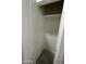 Bathroom closet featuring built-in shelving providing ample storage space at 1835 E Burgess Ln, Phoenix, AZ 85042