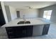 Open-concept kitchen with island, seamlessly flowing into the spacious living area and offering great natural light at 1835 E Burgess Ln, Phoenix, AZ 85042