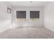 Spacious bedroom featuring neutral carpet, a ceiling fan, and natural light at 20499 W Alsap Rd, Buckeye, AZ 85396