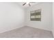 Comfortable carpeted bedroom with a window and neutral-colored walls at 20499 W Alsap Rd, Buckeye, AZ 85396