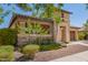 Beautiful single-Gathering home featuring a two-car garage, stone accents, and lush desert landscaping at 20499 W Alsap Rd, Buckeye, AZ 85396