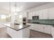 Bright and modern kitchen featuring a large island, and stainless steel appliances at 20499 W Alsap Rd, Buckeye, AZ 85396