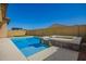 Beautiful backyard oasis with a sparkling pool, integrated spa, and privacy wall at 20499 W Alsap Rd, Buckeye, AZ 85396