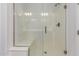 Modern walk-in shower with a glass enclosure and convenient built-in bench at 20499 W Alsap Rd, Buckeye, AZ 85396