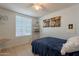 Comfortable bedroom featuring modern decor, natural light, and a relaxing ambiance at 2103 N Silverton St, Mesa, AZ 85203