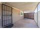 Welcoming covered porch featuring a secure metal gate and ample space for outdoor relaxation and gatherings at 2103 N Silverton St, Mesa, AZ 85203