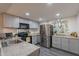 Modern kitchen with sleek stainless steel appliances, ample counter space, and contemporary cabinetry at 2103 N Silverton St, Mesa, AZ 85203
