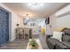 Charming living room with dining area, featuring modern floors, light-filled spaces, and a relaxed ambiance at 2103 N Silverton St, Mesa, AZ 85203